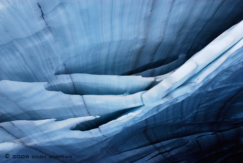 © cody duncan photography.  ceiling of glacier ice cave, Bernese alps, Switzerland