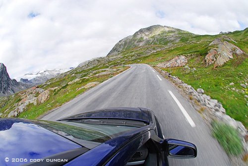 Car driving through Norwegian mountains. © Cody Duncan Photography