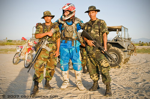 Motorcycle rider and Mexican army soldiers in Baja California, Mexico. © Cody Duncan Photography