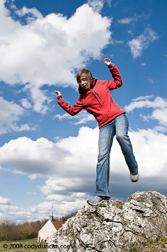 Woman standing on rock. Cody Duncan travel stock photography