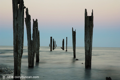 Stock travel Photo: Old ruins of Onekaka pier, Golden Bay, New Zealand. © Cody Duncan photography