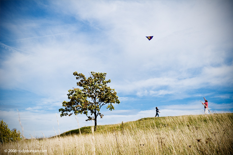 Cody Duncan travel photography: Mother and son fly kite on Walberla Hill, Franconia, Germany