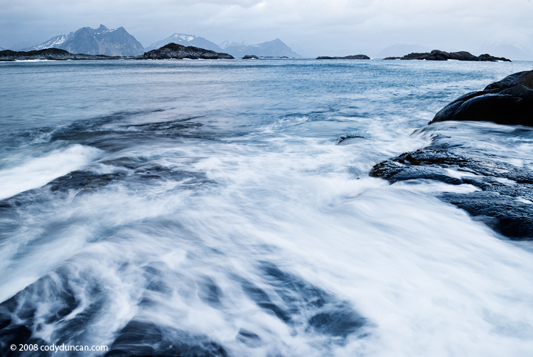 Lofoten Stock photography: Stormy waves crashing against rocks, Stamsund, Lofoten islands, Norway. Cody Duncan Photography