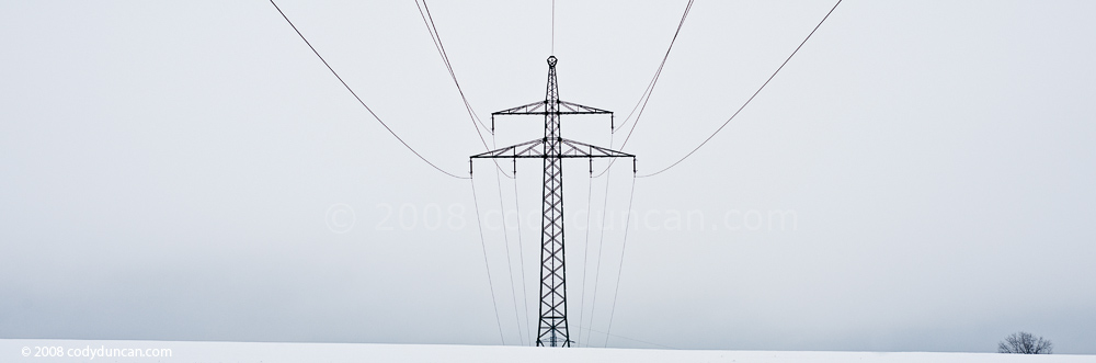 Panoramic stock photo: Germany, Oberpfalz; electrical power lines across barren winter landscape. Cody Duncan Photography