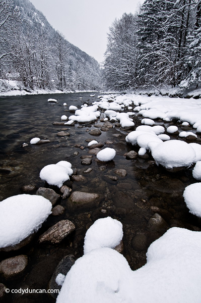 Germany travel stock photo: Snow covered rocks along river, Berchtesgaden, Bavaria