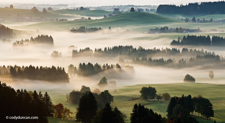 Autumn morning fog clears from rural landscape of Allgaeu region near Eisenberg, Bavaria, Germany