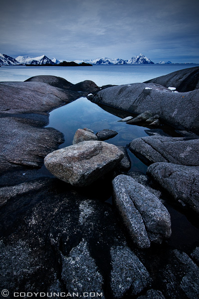 photo of rocky coastline and mountains, Stamsund, Lofoten islands, Norway