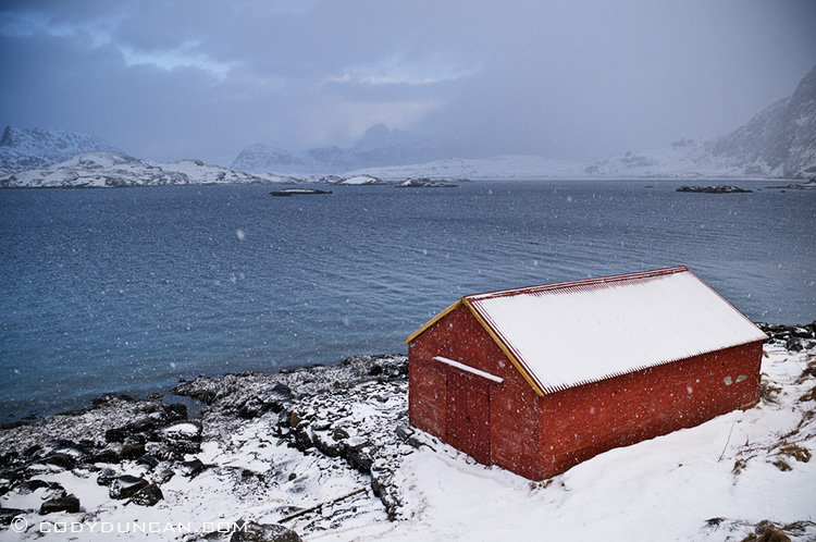Travel landscape stock photography: boat shed in winter snow storm, Selfjorden, Lofoten islands, Norway