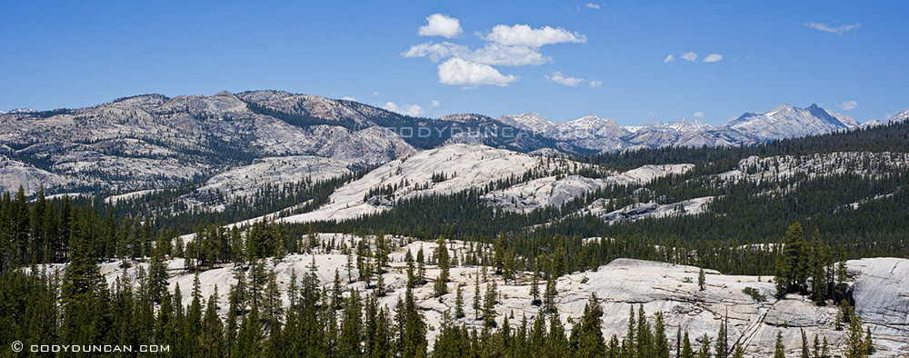 Panoramic landscape photo of granite mountains of Yosemite high country, California