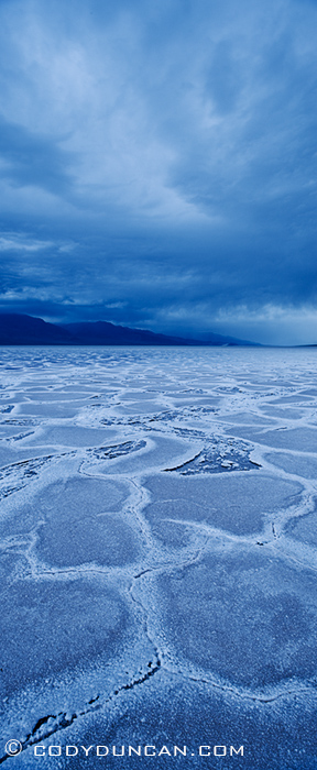 panoramic landscape photography - Rainclouds over Badwater Basin, Death Valley, California. February 27, 2010