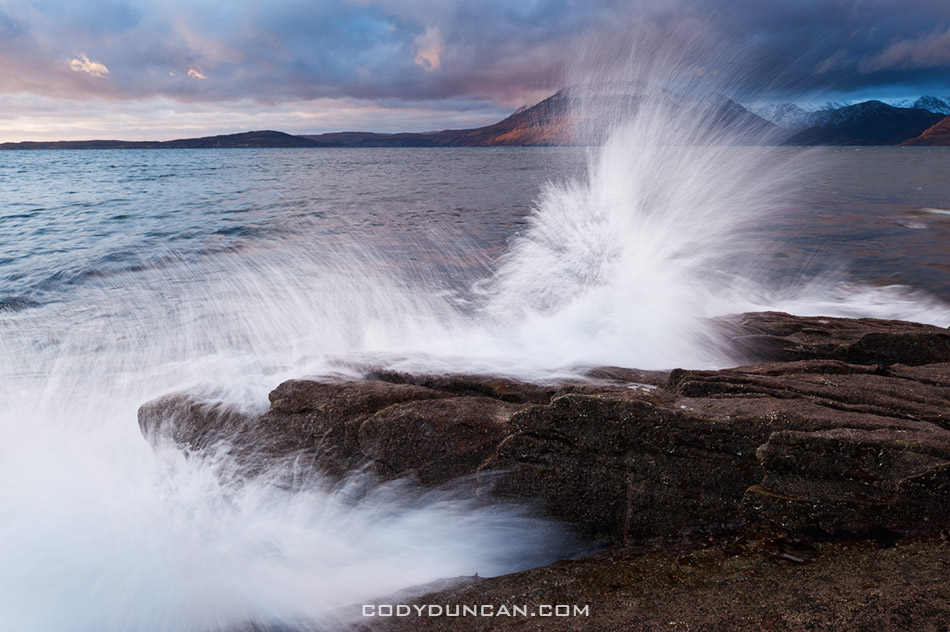Waves crash over rocky shore at Elgol, Isle of Skye, Scotland