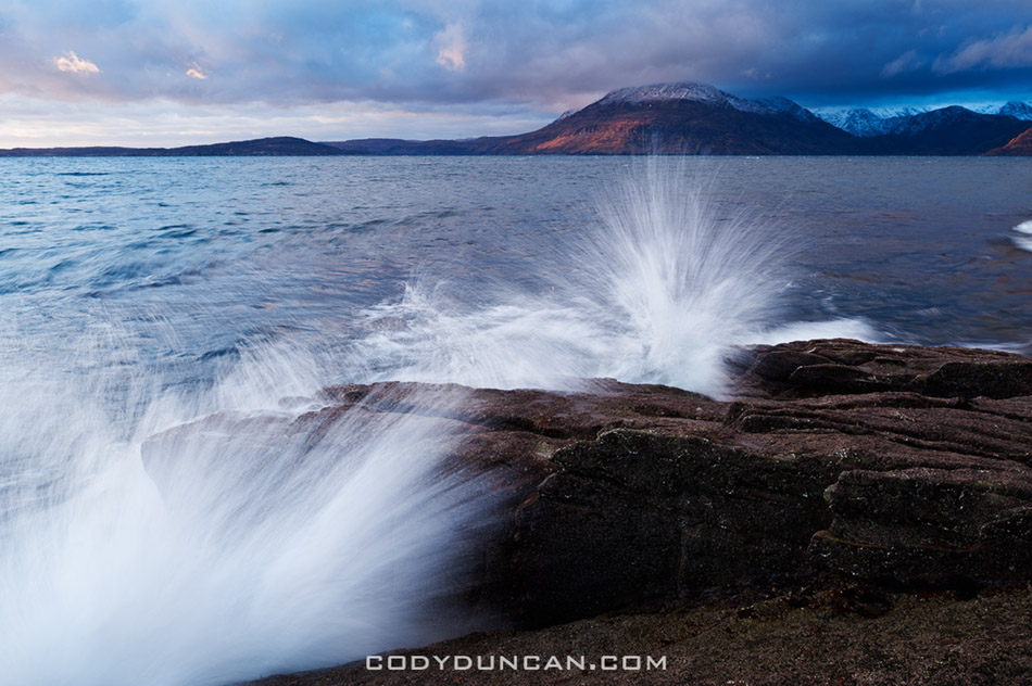 Waves crash over rocky shore at Elgol, Isle of Skye, Scotland