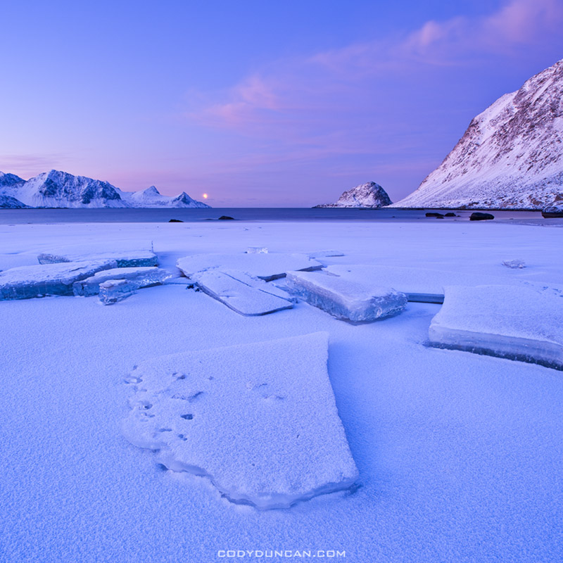 Ice on Haukland beach in winter, Lofoten islands, Norway