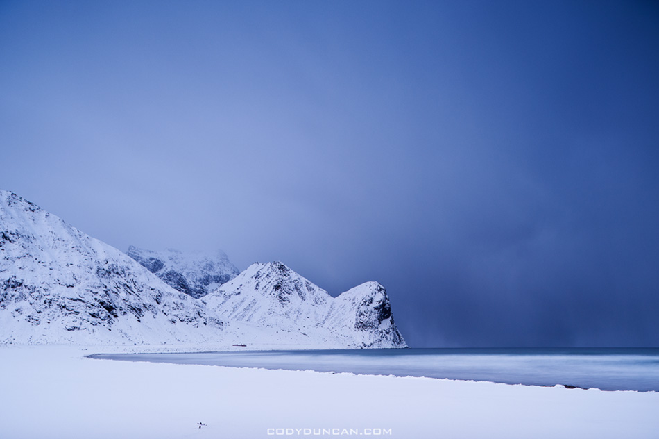 Winter storm over snow covered beach, Unstad, Lofoten islands, Norway