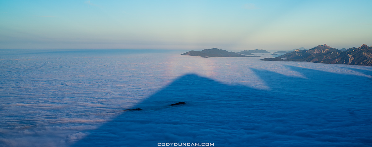 mountain shadows on inversion layer fog, from summit of Breitenberg, Allgäu, Germany