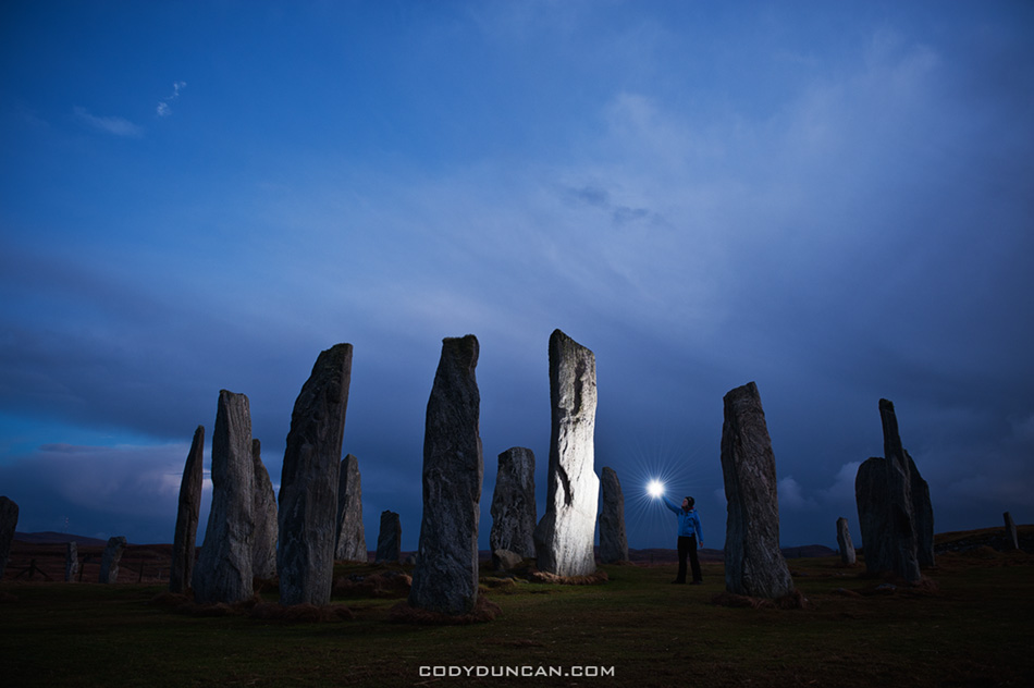Callanish standing stones lit by light at night, Isle of Lewis, Western Isles, Scotland