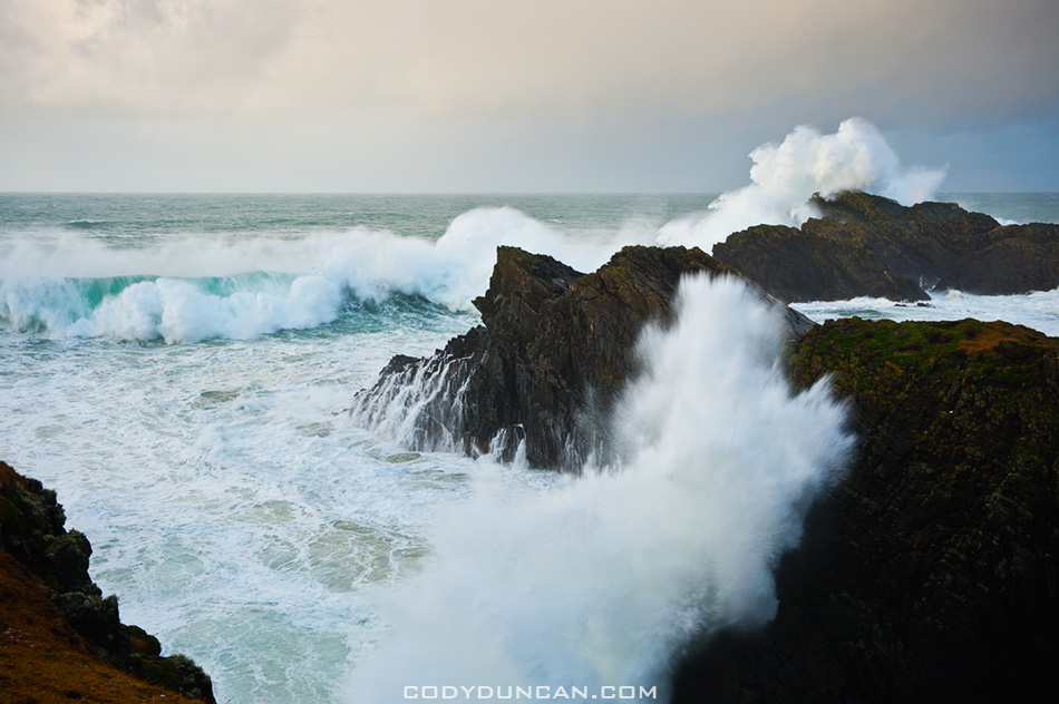 Large winter waves crash against cliffs at Butt of Lewis, Isle of Lewis, Outer Hebrides, Scotland