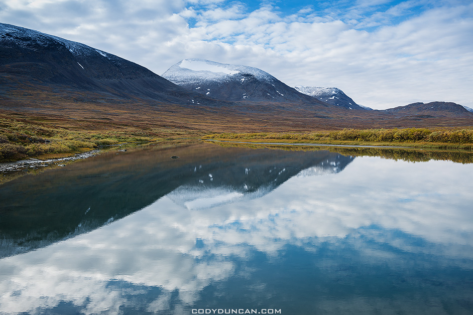 Autumn mountain reflection in river, Alisvagge from near Alesjaure mountain hut, Kungsleden trail, Lappland, Sweden