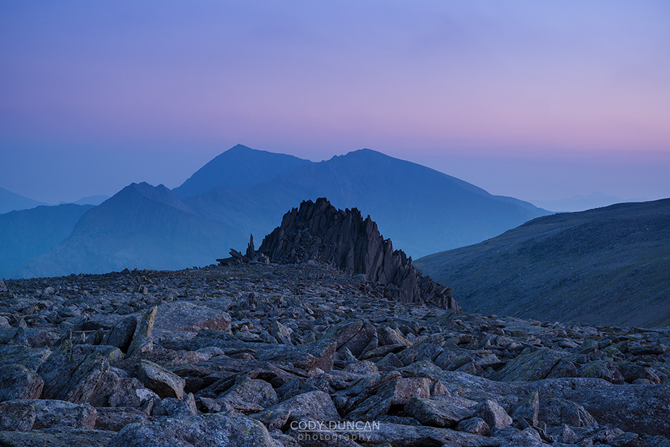 Castell y Gwynt - Castle of the wind with Snowdon in the background from summit of Glyder Fach, Snowdonia national park, Wales